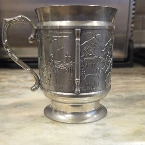 Elegant Silver Mug with Scenic Design